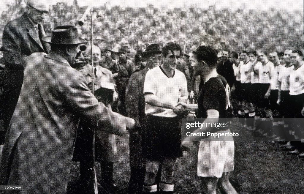 World Cup Final, 1954. Berne, Switzerland. 4th July, 1954. West Germany 3 v Hungary 2. West German captain Fritz Walter receives congratulations from Hungarian captain Ferenc Puskas after the match.