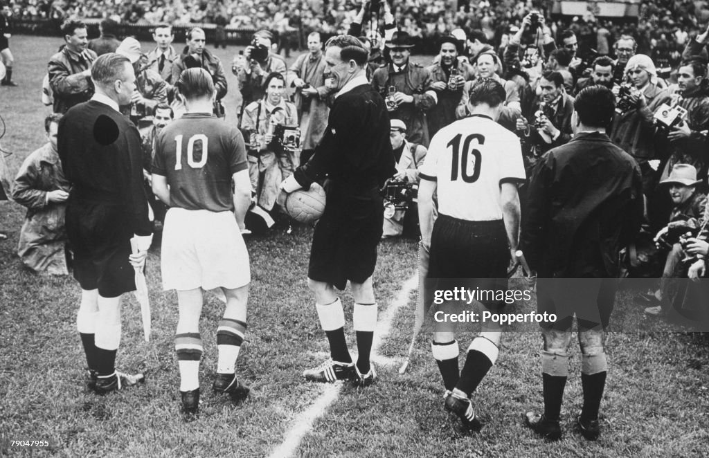 World Cup Final, 1954. Berne, Switzerland. 4th July, 1954. West Germany 3 v Hungary 2. Hungarian captain Ferenc Puskas (10) and West German captain Fritz Walter face photographers with the match officials before the game.