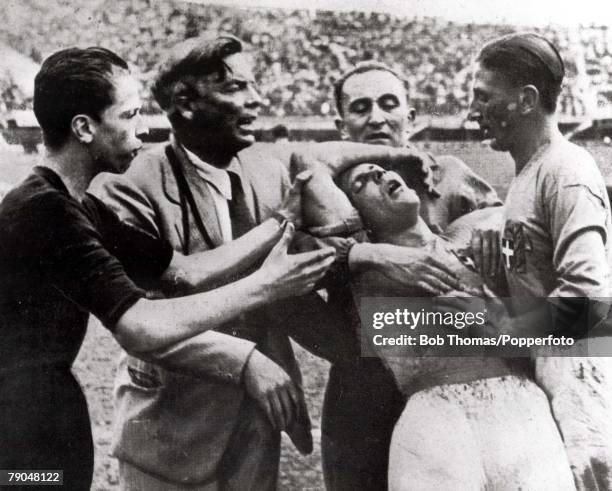 World Cup Quarter-Final, Florence, Italy, 31st May Italy 1 v Spain 1, Italy's Giuseppe Meazza is helped from the field by teammates after being...