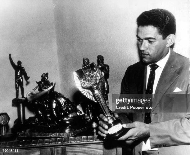 World Cup Finals Chile, Brazil's Garrincha at home with his replica of the Jules Rimet trophy