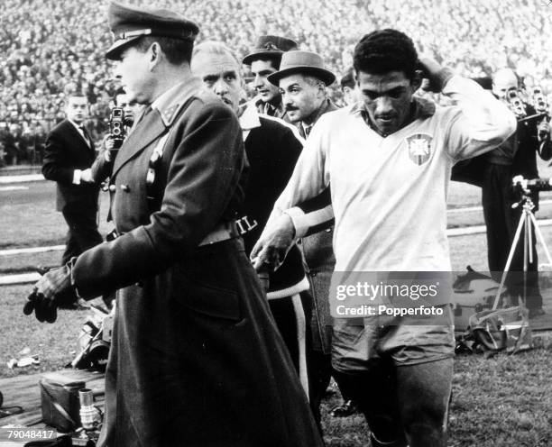 World Cup Semi-Final Santiago, Chile, 13th June Brazil 4 v Chile 2, Brazil's Garrincha, who had been sent off, holds his head after being hit by a...