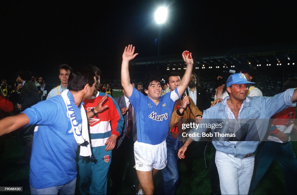 Football. UEFA Cup Final, Second Leg. Naples, Italy. 17th May 1989. Napoli 2 v VfB Stuttgart 1 (Napoli win 5-4 on aggregate). Napoli captain Diego Maradona celebrates with supporters at the end of the match.