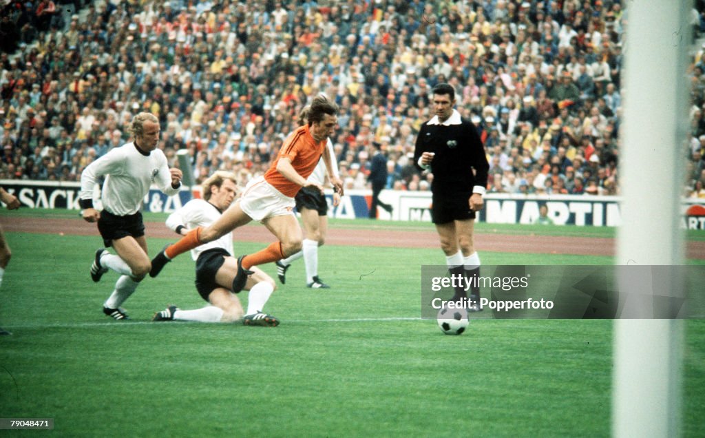 1974 World Cup Final. Munich, West Germany. 7th July, 1974. West Germany 2 v Holland 1. Holland's Johan Cruyff is tripped by West Germany's Uli Hoeness in the first minute of the match to win a penalty watched by referee Jack Taylor. Johan Neesken scored 