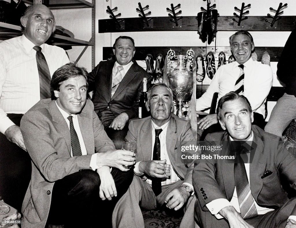 Sport. Football. Liverpool v Spurs. May 1982. Liverpool won the League. A picture of Liverpool+s coaching staff enjoying a celebratory drink in the famous Anfield boot room. (Left-right): Ronnie Moran, Roy Evans, Bob Paisley (Manager), Tom Saunders, John 