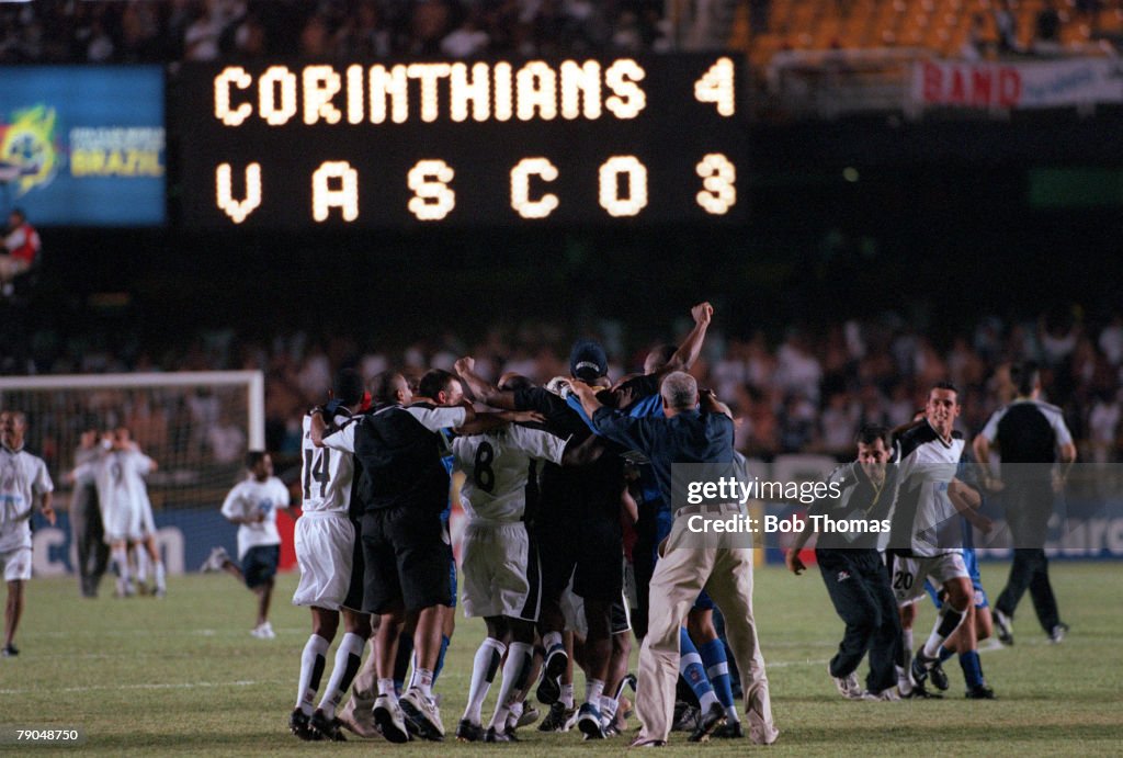 Sport. Football. FIFA Club World Championships Final. Rio De Janeiro, Brazil. 14th January, 2000. Corinthians 0 v Vasco Da Gama 0. (Corinthians win on penalties). Corinthians' players celebrate their victory after the penalty shoot out as the electronic s