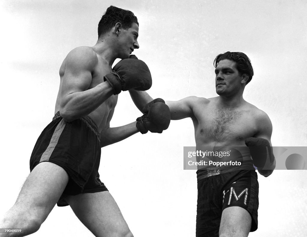 Sport. Boxing. England. 1941. Sgt. Freddie Mills of the RAF is pictured in training with a partner outdoors. Freddie later became Light Heavyweight World Boxing Champion.