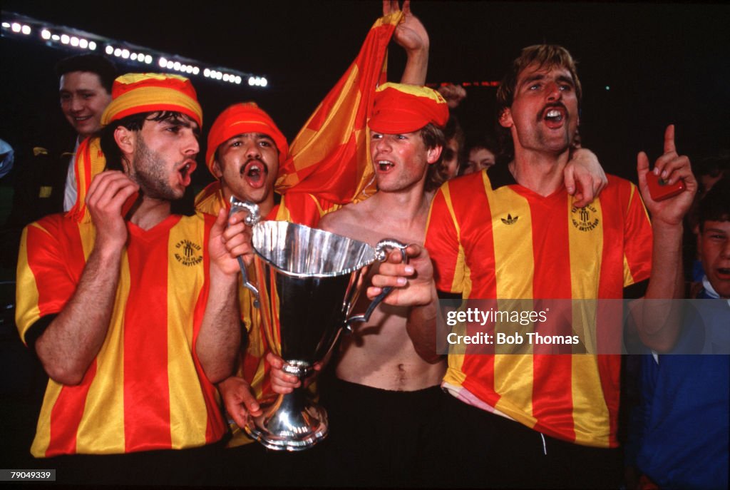 Football. UEFA Cup Winners Cup Final. Strasbourg, France. 11th May 1988. Mechelen 1 v Ajax Amsterdam 0. Mechelen players L-R: Eliahu Ohana, Pascal De Wilde, Erwin Koeman and goalscorer Pieter Den Boer hold the trophy during celebrations.