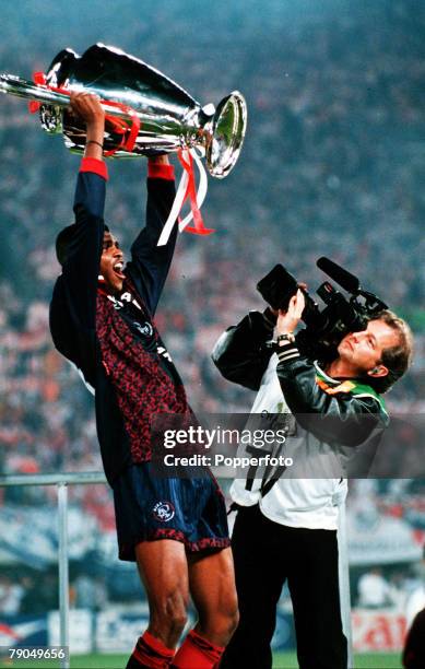 Volume 2, Page 7, Picture number, Sport, Football, European Cup Final, Vienna, Austria, 24th May Ajax 1 v AC Milan 0, Ajax's Nwankwo Kanu holds up...