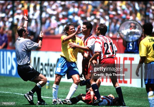 Football, 1994 World Cup Finals, Second Phase, Palo Alto, USA, 4th July 1994, Brazil 1 v USA 0, Referee Quiniou shows the red card to Brazil's...