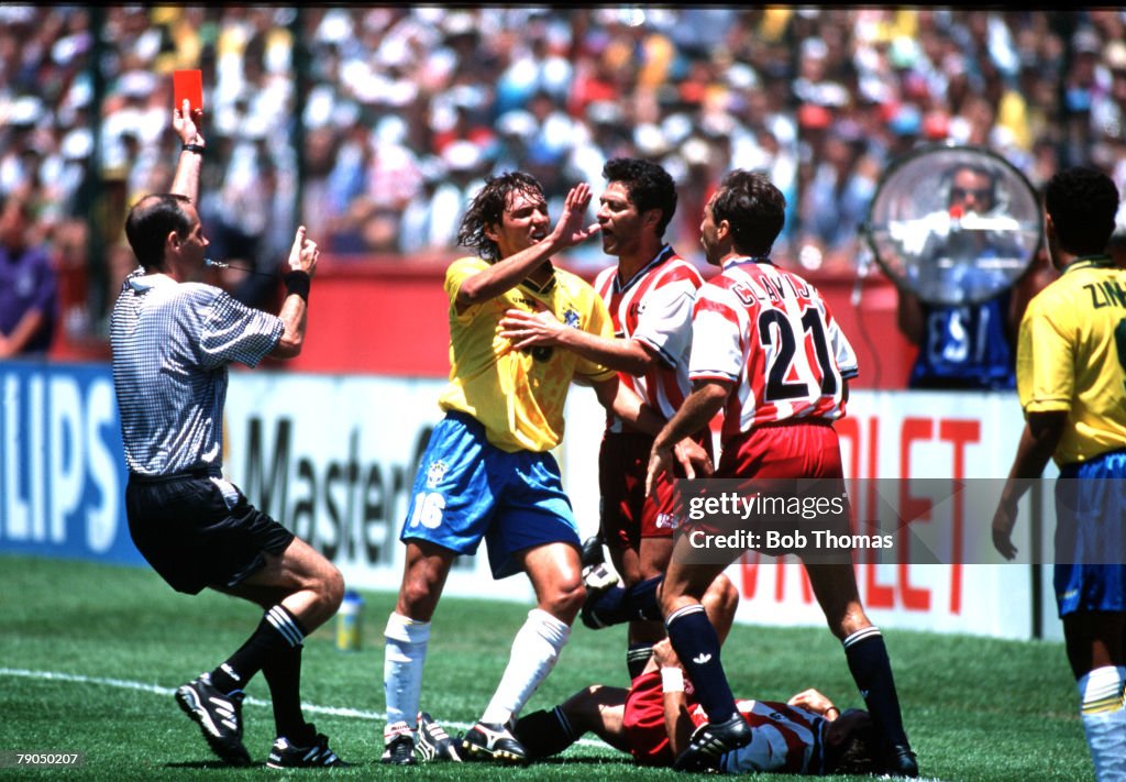 Football. 1994 World Cup Finals. Second Phase. Palo Alto, USA. 4th July 1994. Brazil 1 v USA 0. Referee Quiniou shows the red card to Brazil's Leonardo during the match after injuring USA's Tab Ramos with an elbow to the face.