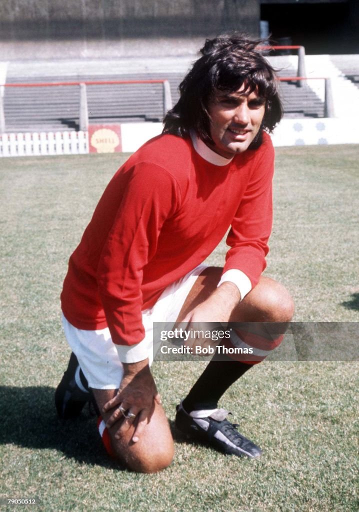 Football. Manchester United footballer George Best poses in the club strip at Old Trafford