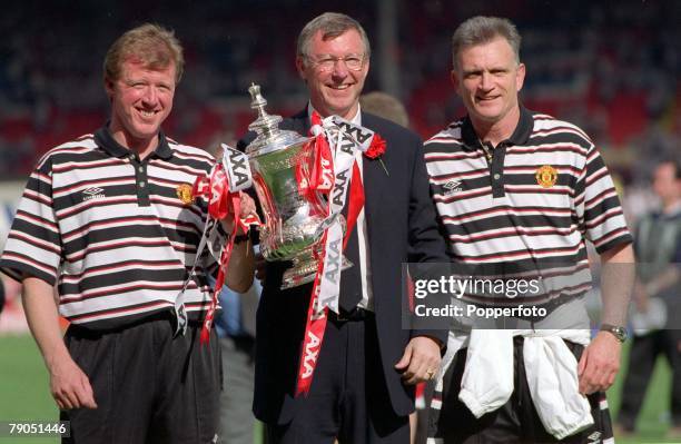 22nd MAY 1999, F.A. Cup Final, Wembley, Manchester United 2 v Newcastle United 0, Manchester United Manager Alex Ferguson with the trophy flanked by...