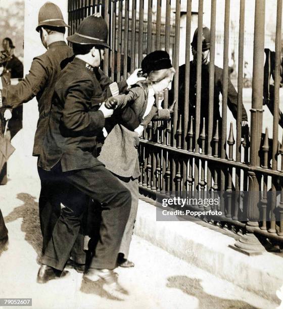 Classic Collection, Page 88 1914, Policemen arresting Suffragettes who had chained themselves to the railings of Buckingham Palace