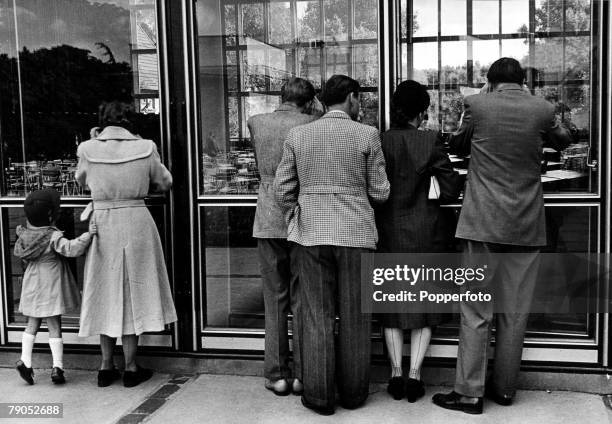 Classic Collection, Page 94 Bonn, Germany, Circa 1952, A man, woman and little girl look through the window of the new German Parliament Building, in...