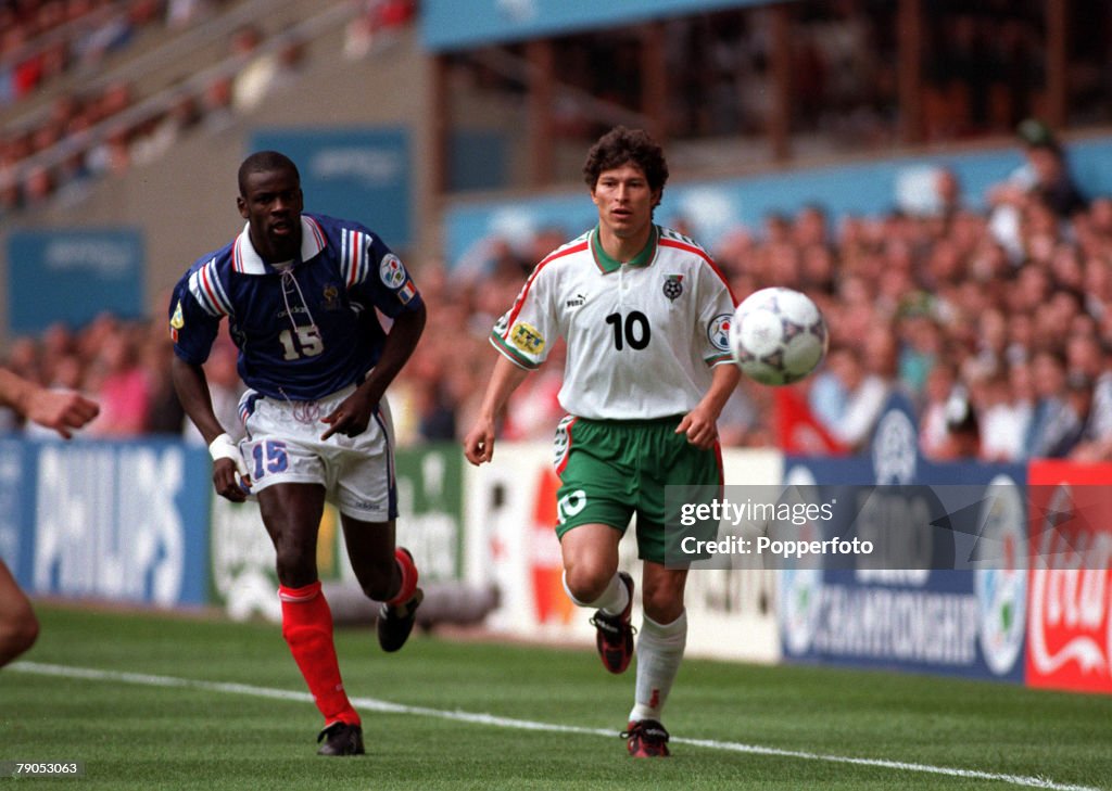 Sport, Football, European Championship. 18th. June 1996 (St. James park, Newcastle). France 3 v 1 Bulgaria. France's Thuram and Bulgaria's Balakov chase the ball.