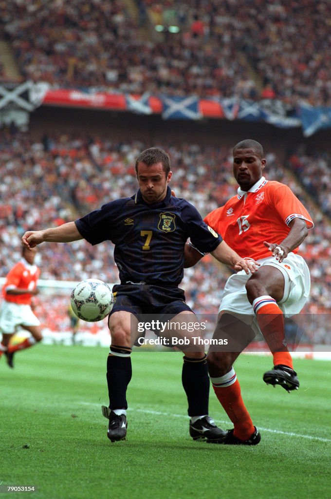 Sport, Football. European Championships, 10th. June 1996. (Aston Villa). Holland 0 v Scotland 0. Scotland's John Spencer with Holland's Winston Bogarde.
