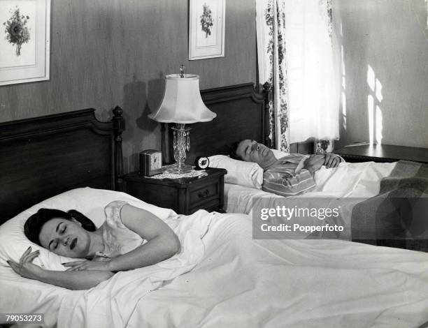 Classic Collection, Page 119 A man and woman in separate beds, asleep