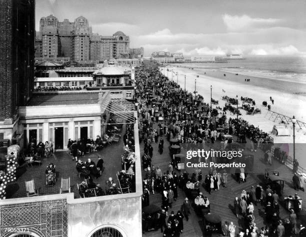 Classic Collection, Page 116 Atlantic City, New Jersey, USA, People mill around on the boardwalk next to the beach and sea, as others look down from...