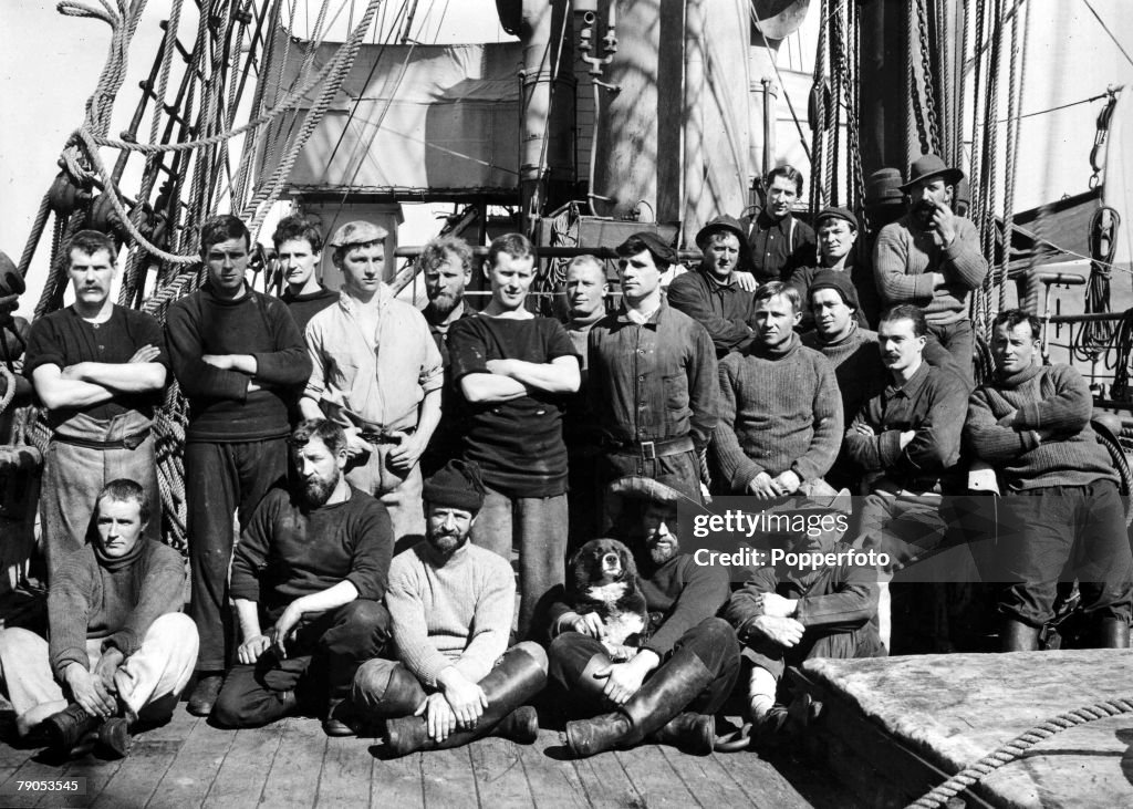 H.G Ponting. Captain Scott+s Antarctic Expedition 1910 - 1912. A group of officers pose for a photograph on the deck of the Terra Nova.