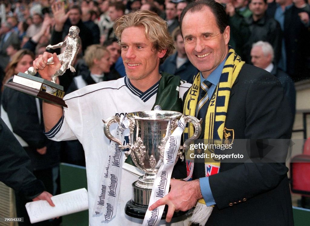 21th March 1999. Worthington Cup Final. Wembley. Tottenham Hotspur 1 v Leicester 0. Spurs manager George Graham and goalscorer Allan Neilson celebrate at the end of the match with the trophy.