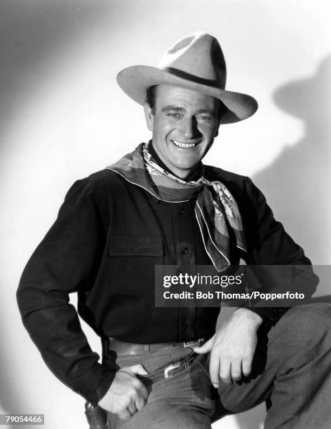 Volume 2, Page 103, Picture 5 US film actor John Wayne pictured on the set of the Western -Stagecoach+