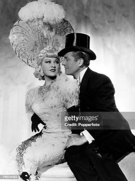 Volume 2, Page 103, Picture 6 US film actress Mae West and Edmund Lowe in -Everyday+s a Holiday+