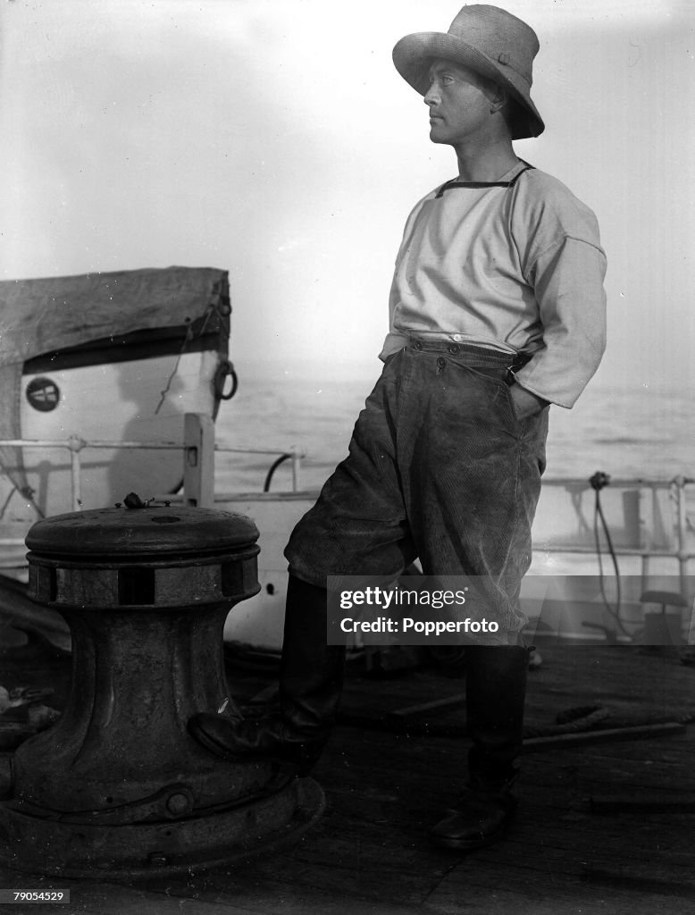 H.G Ponting. Captain Scott+s Antarctic Expedition 1910 - 1912. Full length portrait of Lieutenant Rennick on board the Terra Nova off the coast of New Zealand.