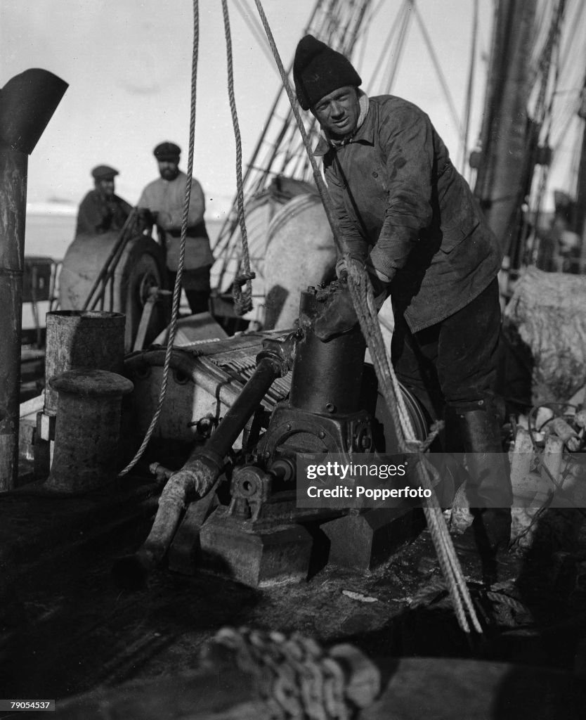 H.G Ponting. Captain Scott+s Antarctic Expedition 1910 - 1912. Expedition team member Williams at the sounding engine on board the Terra Nova ship.