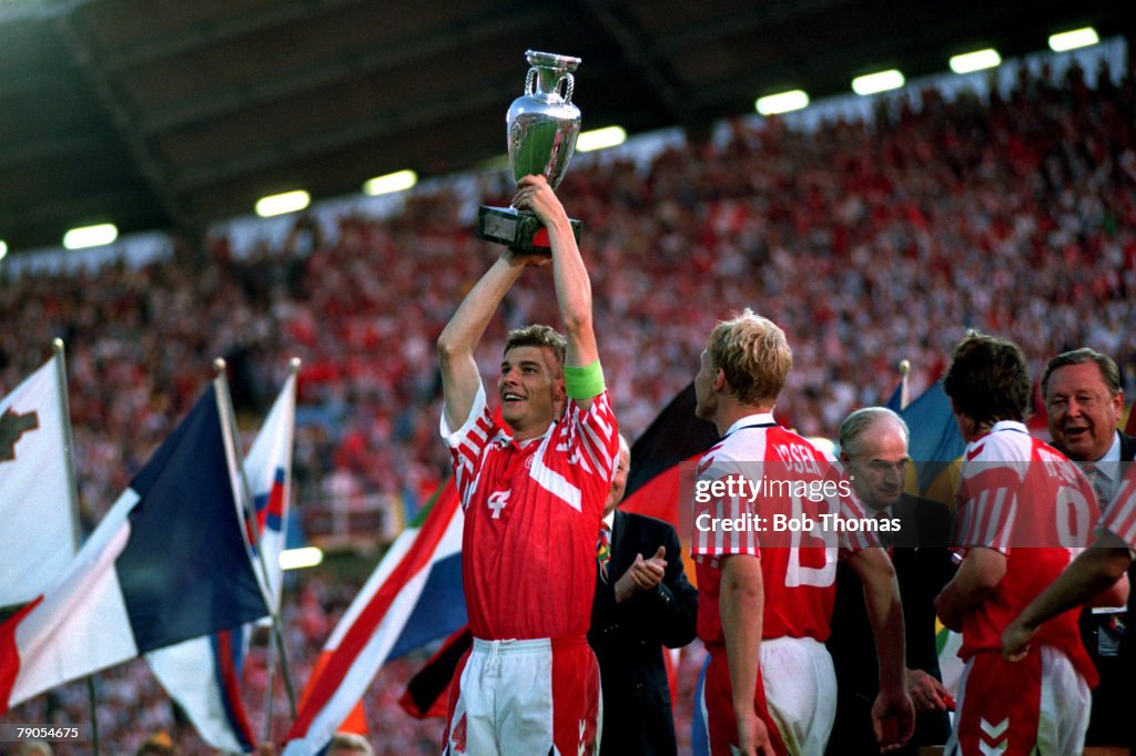 Sport, Football. 1992 European Championships Final. Gothenburg, Sweden. Denmark 2 v Germany 0. Denmark's Lars Olsen holds the trophy aloft.