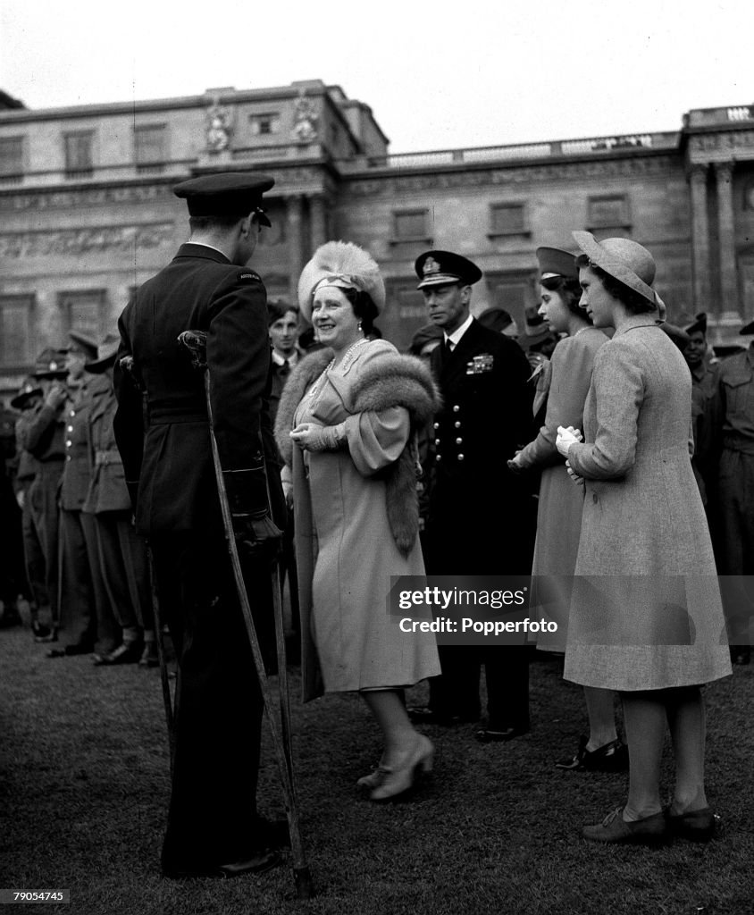 25th May, 1945. Garden Party at Buckingham Palace. King George VI and Queen Elizabeth (later the Queen Mother) and the their two daughters Princess Elizabeth and Margaret meet repatriated prisoners of war. 1945. at the end of World War Two. Flying Officer