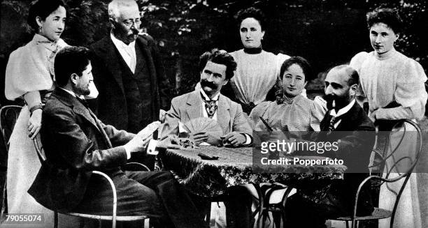Austria, Johann Strauss, playing a game of cards in the garden of his home at Bad Ischl, Beside him stands his wife, Frau Adele Strauss, the man...