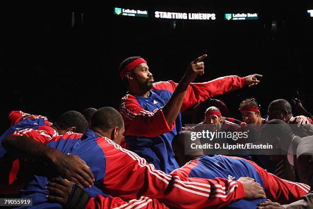 Rasheed Wallace of the Detroit Pistons dances in the team huddle prior to the game against the Milwaukee Bucks on December 31, 2007 at the Palace of...