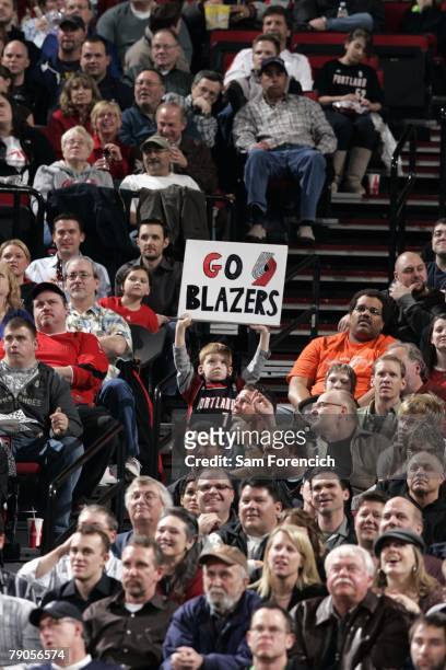Young fan holds up a "Go Blazers" sign during the game between the Utah Jazz and the Portland Trail Blazers at the Rose Garden Arena on January 5,...