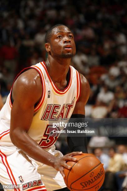 Dwyane Wade of the Miami Heat shoots a foul shot against the Washington Wizards during the game on December 13, 2007 at American Airlines Arena in...