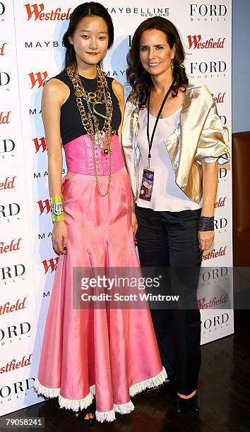 Model contest winner Seung-hyun Kang and Ford Model CEO Katie Ford pose for photos during Supermodel of the World hosted by Ford Models at Terminal 5...