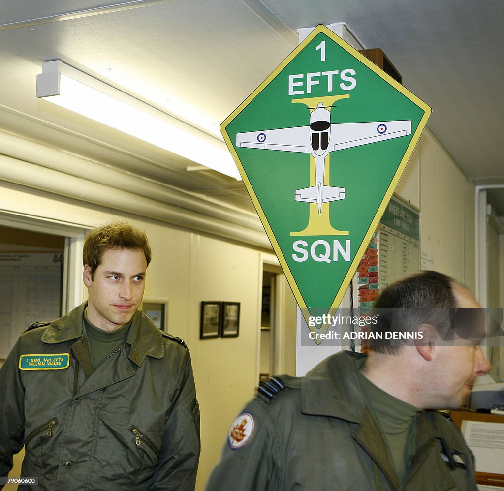 Prince William (L) alongside his instruc
