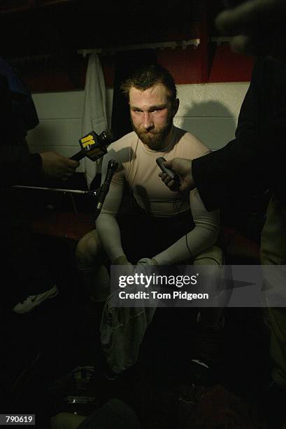 Erik Cole of the Carolina Hurricanes is interviewed in the locker-room after being defeated by the Detroit Red Wings in game five of the NHL Stanley...