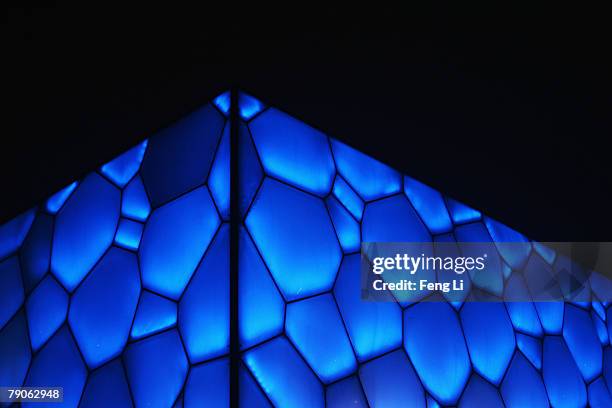 The night scene of the construction site of the National Aquatics Centre in the snow on January 17, 2008 in Beijing, China. The centre, built for the...