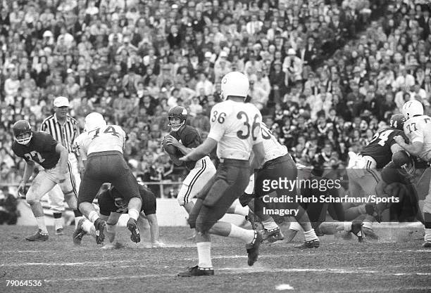 Fred Marshall of the Arkansas Razorbacks goes back to pass against the Nebraska Huskers during the 1965 Cotton Bowl on January 1, 1965 in Dallas,...