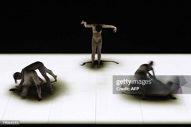 Australian dancers perform the 'Mortal Engine', a dance-video-laser piece at the Sydney Opera House, 17 January 2008. The work choreographed by...