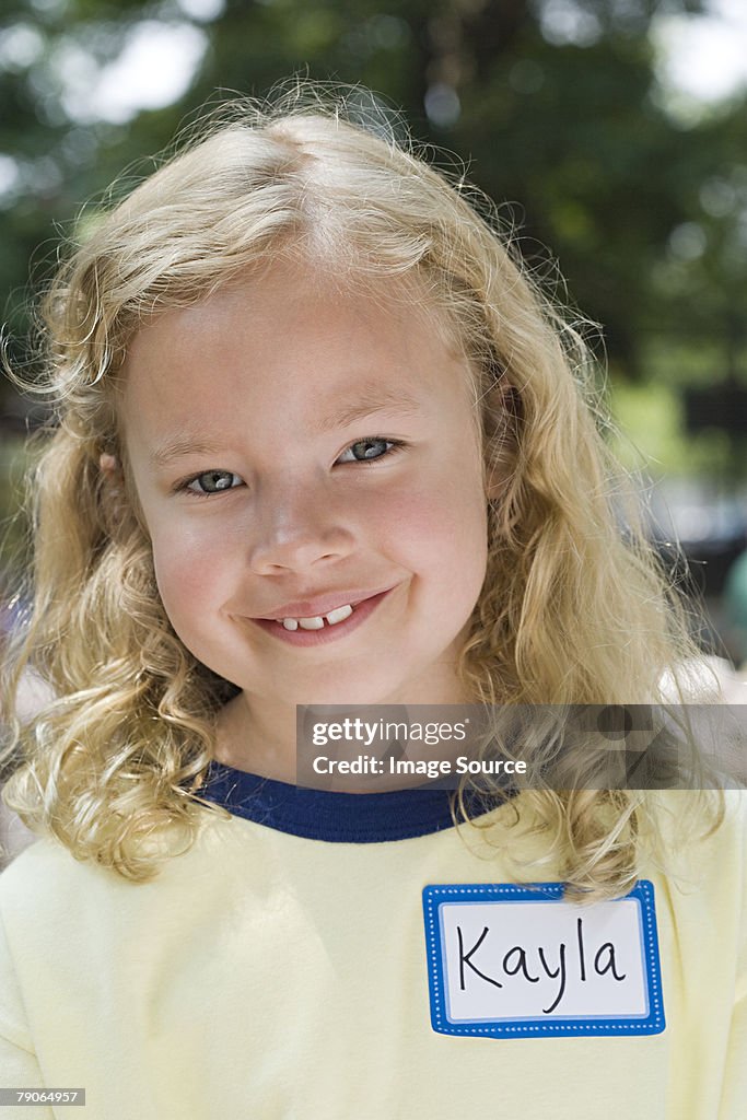 Portrait of a girl with name tag
