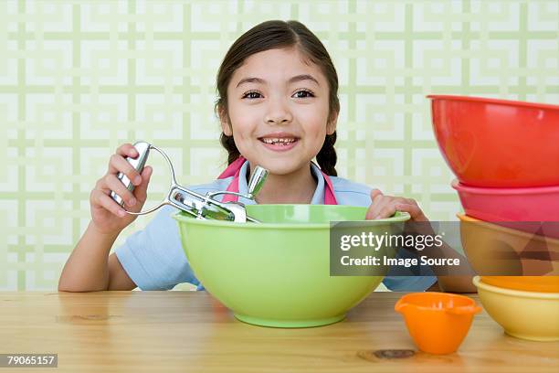 girl with a mixing bowl and whisk - mixing bowl stock pictures, royalty-free photos & images