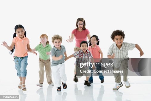 Chasing Toddler Riley A Teacher Chasing Children Stock-Foto - Getty Images