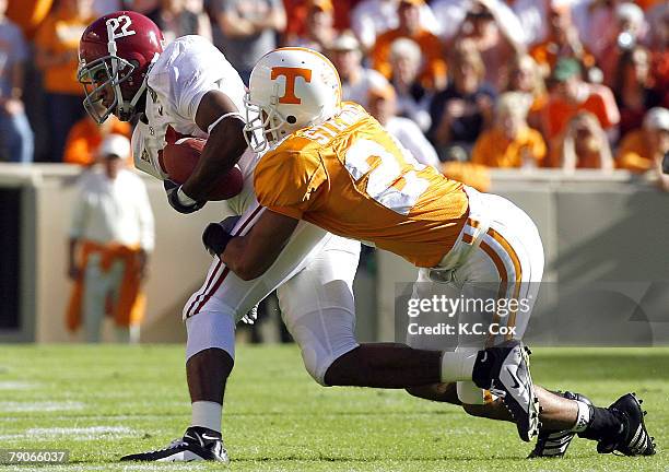 Tennessee's Antwan Stewart tackles Alabama receiver D.J. Hall during the first half Saturday, October 21 at Neyland Stadium in Knoxville, Tennessee.