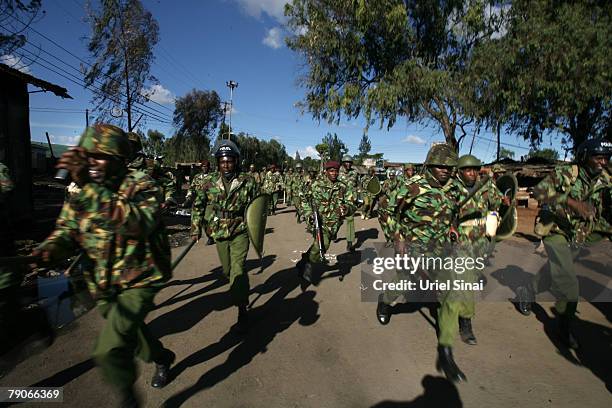 Kenyan riot police charge towards supporters of Kenya's opposition leader Raila Odinga during the second day of attempts to disperse renewed protests...