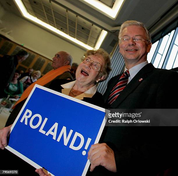 Roland Koch , Governor of the German federal state of Hesse and party leader of the Christian Democratic Union Hesse smiles with an unidentified...