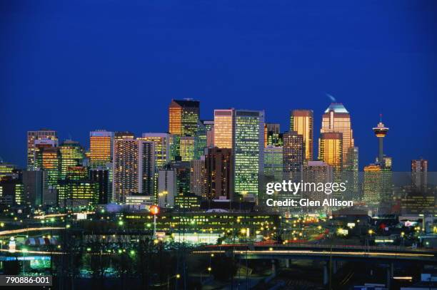 canada, alberta, calgary, skyline at dusk - calgary skyline stock pictures, royalty-free photos & images