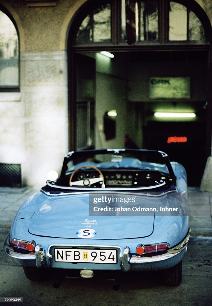 A blue Jaguar E-type.