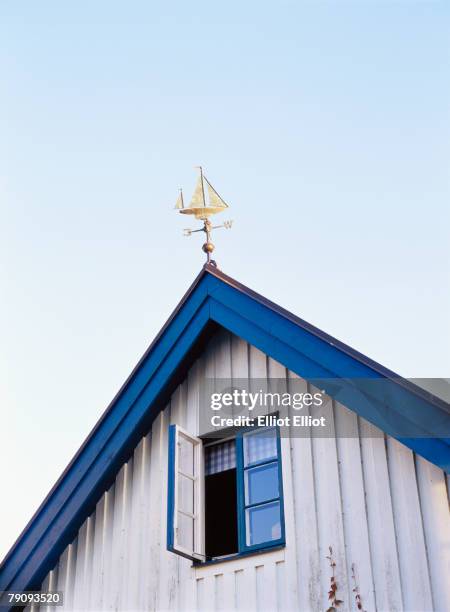 a weather vane on a roof. - window ajar stock pictures, royalty-free photos & images