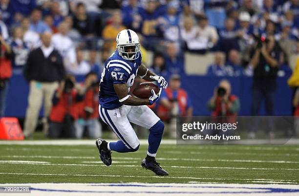 Reggie Wayne of the Indianapolis Colts runs for yards after the catch against the San Diego Chargers during their AFC Divisional Playoff game at the...